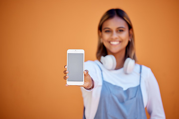 Image showing Portrait, mockup and woman with smartphone, smile and screen with girl on brown studio background. Face, female and girl with cellphone, space or connection for social media, chatting and on backdrop