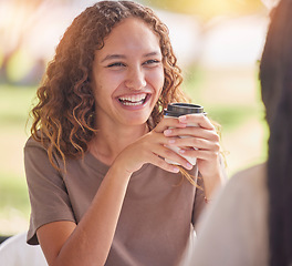 Image showing Woman, friends and smile for coffee, chat or catch up on social life, friendship or relationship at an outdoor cafe. Happy female smiling in happiness for chatting, conversation or funny discussion