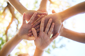 Image showing Hands, community and group in unity for trust, support or teamwork goals piling together below for collaboration in nature. Hand of people in solidarity, union or coordination for united team effort