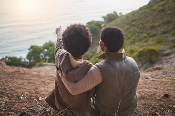 Image showing Relax, ocean and hiking with black couple on mountain for adventure, nature and sunrise. Peace, discovery and expedition with man and woman hiker on path for trekking, freedom and travel vacation