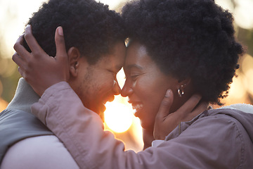 Image showing Couple, love and hiking in sunset kissing and faces touching outdoors after workout, fitness and exercise. Romantic African American healthy people affectionate after training together in nature