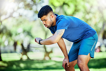 Image showing Exercise, outdoor and man check time, heart rate and schedule for training, workout and fitness for wellness. Sports, male and athlete with smartwatch, cardio and tracker for progress, target or goal