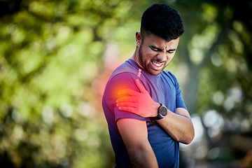 Image showing Man, exercise and outdoor with sports injury, joint pain or health problem in nature park during run. Fitness person with hand on arm or muscle after accident during workout or training fail