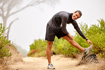 Image showing Fitness, stretching legs and portrait of man on nature trail for running, marathon training and cardio workout. Sports, healthy body and happy male athlete warm up for wellness, exercise and hiking