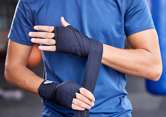 Image showing Fitness, boxing and tape with hands of man in gym for sport, workout and martial arts training. Exercise, strong and wellness with boxer and wrap bandage in mma class for fight, health or performance