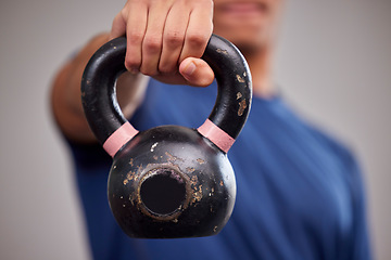 Image showing Fitness, kettlebell and man athlete in a gym for a arm muscle workout or sport training. Sports, weights and healthy male bodybuilder doing a strength exercise in a gymnasium or wellness studio.