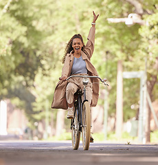 Image showing Happy black woman, bike and cycling in the park for fun holiday break, weekend or travel in the outdoors. African American female smiling in happiness and enjoying bicycle ride, traveling or freedom