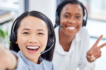 Image showing Call center woman, selfie and teamwork with friends, diversity and happiness in crm workplace. Customer support agent team, consultant ground and peace with women, african and asian with solidarity