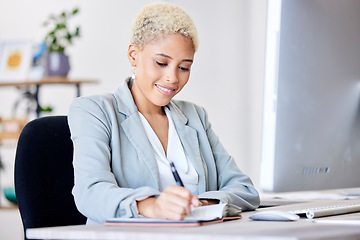 Image showing Business woman, writing and planning schedule in notebook with a smile at office administration desk. Professional person happy while making note of agenda, list and planner for corporate management