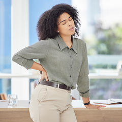 Image showing Business, back pain and black woman with stress, burnout and fatigue in office, muscle strain and overworked. African American female employee, entrepreneur or leader with healthcare issue and injury