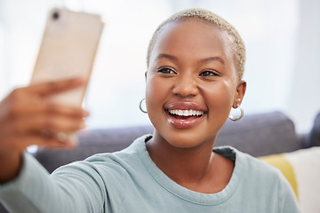 Image showing Black woman, influencer and smile for selfie, social media or profile picture relaxing on living room sofa at home. African American female vlogger smiling in happiness for online post in the lounge