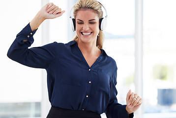 Image showing Dancing woman listening to music in office for energy, fun and happy celebration with mental health wellness. Excited, smile and success or dance worker or person in headphones and audio technology