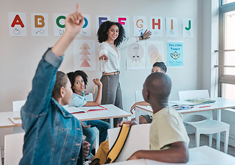 Image showing Teacher, classroom and education at school with children learning the alphabet and answer a question. Raised hands, learners and tutor teaching for child development in a class with smart kids