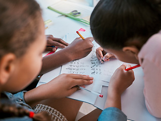 Image showing School, kids and hands writing for learning activity in group classroom together with top view. Young children and students working on literacy and academic exercises for development at desk.