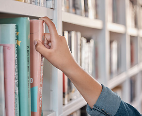 Image showing Books, education or hand in a library to search for knowledge or development for future growth. Scholarship, zoom or college student searching, studying or learning university information at school