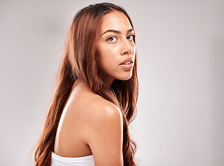 Image showing Face, mockup and woman with hair in portrait, beauty and skin with glow and shine isolated on studio background. Hairstyle, cosmetic skincare and wellness with keratin treatment and styling