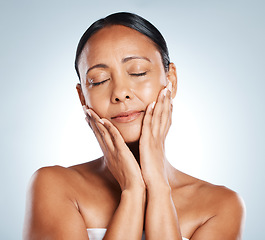 Image showing Face, beauty skincare and woman with eyes closed in studio isolated on a gray background. Cosmetics, makeup and mature and beautiful female model satisfied after spa facial treatment for healthy skin