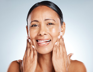 Image showing Face, beauty skincare and woman with tongue out in studio isolated on a gray background. Portrait, makeup cosmetics and happy senior female model satisfied with spa facial treatment for healthy skin.