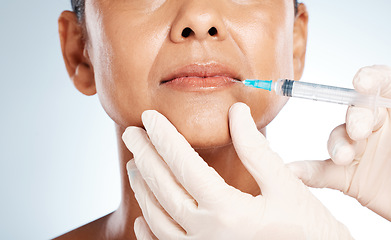 Image showing Injection, plastic surgery and lip filler on woman face for cosmetics, collagen and beauty salon. Skincare, facial needle and botox aesthetic, liposuction and body transformation on studio background