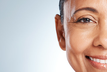 Image showing Half face, beauty and senior woman in studio isolated on gray background mockup. Makeup cosmetics, skincare and portrait of happy female model with glowing and healthy skin after spa facial treatment