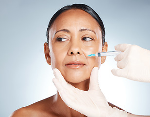 Image showing Syringe, woman face and plastic surgery with botox for skincare, collagen and medical beauty. Cosmetics, facial injection and botox aesthetic, liposuction and body transformation on studio background