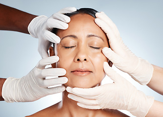 Image showing Cosmetics, plastic surgery and hands check woman face for laser, botox implant or beauty salon. Skincare consultation, facial or gloves of aesthetic change, liposuction or filler on studio background