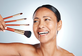 Image showing Makeup, skincare and old woman with brushes, foundation and with grey studio background. Mature female, senior lady and cosmetics tools for dermatology, retirement and beauty for soft and clear skin