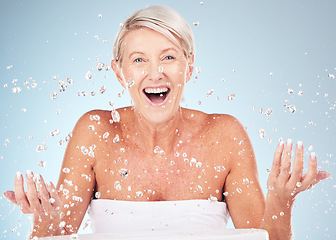 Image showing Shower, face and old woman excited with water drops, clean skin and antiaging skincare, elderly model isolated on studio background. Beauty, senior cosmetic care and facial portrait, wow and hygiene