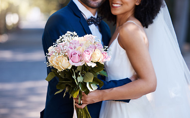 Image showing Flowers, wedding and marriage with a bride and groom posing outdoor for a photograph at their celebration event or ceremony. Rose bouquet, love and romance with a newlywed black couple outside