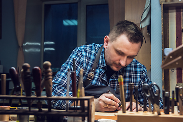 Image showing Concept of handmade craft production of leather goods.