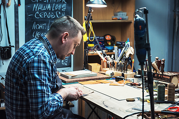 Image showing Concept of handmade craft production of leather goods.