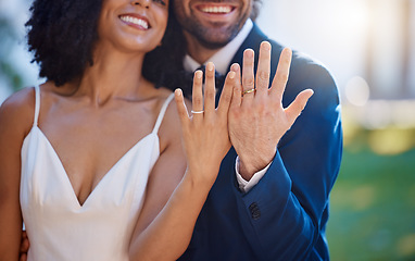 Image showing Married couple, hands and wedding rings with smile for marriage, commitment or honeymoon in the outdoors. Hand of happy groom and bride smiling and showing ring in symbol for wife and husband