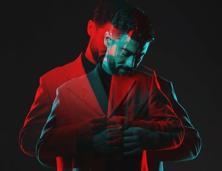 Image showing Double exposure, fashion and man on black background in vintage clothes, elegant and classy suit. Creative aesthetic, red shadow and male model with luxury, designer and stylish clothes in studio