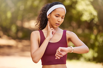 Image showing Tired, time and woman with pulse check in nature for fitness, training motivation and steps in Argentina. Sports, health and athlete runner with watch for a forest workout, heart cardio and exercise