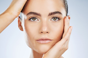 Image showing Beauty, skincare and portrait of a woman with makeup isolated on a grey studio background. Glow, clean and face of a spa dermatology model with facial health, hydration and wellness on a backdrop