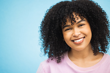 Image showing Face, smile and portrait of black woman on blue background with makeup, cosmetics and fashion mockup. Beauty, advertising and happy girl with copy space for retail sale, promotion news and discount