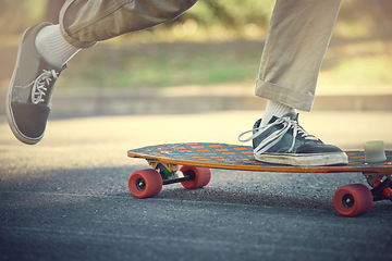 Image showing City, street sport and shoes on skateboard for teenage fun, alternative transport or urban fitness. Road, sneakers and free skateboarder feet riding board in park with balance and eco friendly travel