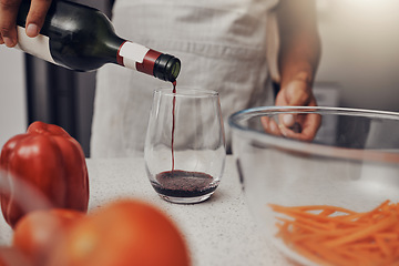 Image showing Man, cooking vegetables and red wine glass, bottle and hands in kitchen while making salad. Chef person with alcohol for making dinner for healthy vegan eating lifestyle in a house or apartment