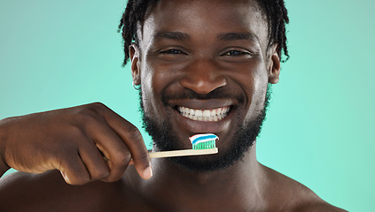 Image showing Black man, face and toothbrush, happy portrait with smile for teeth whitening and cleaning mouth isolated on studio background. Fresh breath, beauty and hygiene with toothpaste, health and dental