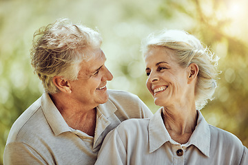Image showing Love, hug or happy old couple in nature bonding or laughing in a marriage partnership in retirement. Peace, senior man or romantic elderly woman hugging together on a calm relaxing holiday vacation