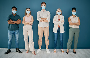 Image showing Portrait, covid and group of business people with arms crossed in office for health and safety. Teamwork, compliance and workers, men and women with face mask or ppe to stop corona virus for wellness