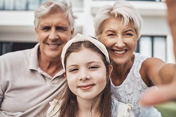 Image showing Portrait, grandparents and child love taking a selfie as a happy family in summer holidays in a backyard. Elderly, relax or girl smiles in a picture while bonding with grandmother and old man at home