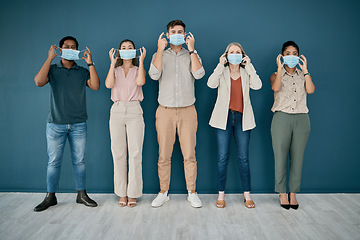 Image showing Portrait, covid and group of business people in office for health and safety. Teamwork, compliance and employees, men and women with face mask or ppe to stop corona virus for wellness in workplace.