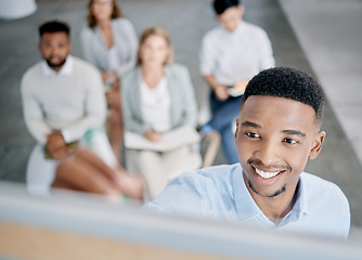 Image showing Face, meeting and presentation with a business black man writing on a whiteboard while coaching his team. Training, growth and planning with a male employee giving a learning workshop for development