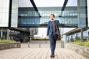 Image showing Phone call, communication and happy businessman walking, networking and talking on 5g conversation in New York. Architecture mockup, real estate agent and professional on commute to office building