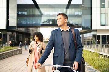 Image showing Bike, commute and city with a business man using eco friendly transport for travel to his office for work. Bicycle, building and a male employee walking while thinking about carbon neutral commuting