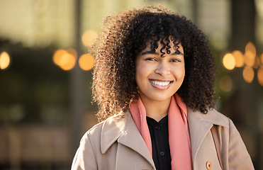 Image showing Black woman, portrait and city travel with a happy smile while outdoor on London street with freedom. Smiling face of young person with natural afro hair, beauty and fashion style during holiday walk