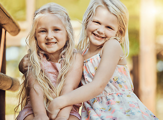 Image showing Happy, girl smile and teddy outdoor portrait with happiness, sisters and bonding together. Freedom, children and smiling of young kids with friend love and care in a park or garden playground