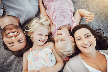 Image showing Happy family, portrait and children with mom and father relaxing and smiling from top view from a park outdoors. Kids, overhead and excited parents with love, care and happiness bonding