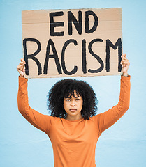 Image showing Black woman protest, poster and angry at racism, fight for equality, human rights and freedom isolated on blue background. Global problem, social justice and revolution, anger in studio and politics